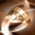 Wedding Rings Gold Turning HD Video Background 0336