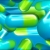 Capsules Sky Blue & Yellow Green Spinning HD Video Background 0706