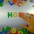 Hand Writes How with Fridge Magnets