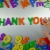 Hand Writes Thank You with Fridge Magnets