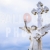 Angel Statue in Front of Cross Blue Cloudy Sky