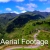 Aerial Footage of Mountain Road with Motorcycle and Rain Forest