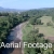 Aerial Footage of River with Palms and Fields