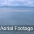 Aerial Footage of Ocean and Sand Bank with Land in Horizon