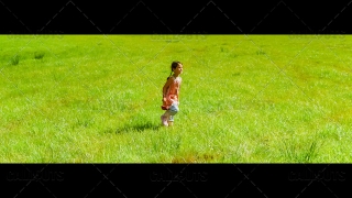 Girl walking with Berry Basket on Green Grass Fields
