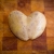 Heart Shaped Potato on Cutting Board