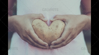 Heart Potato Held by Stomach