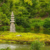 Japanese stone pagoda on an island in a garden pond or lake