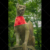 Fushimi Inari-taisha shrine, fox statue with red scarf. Kyoto, Japan.