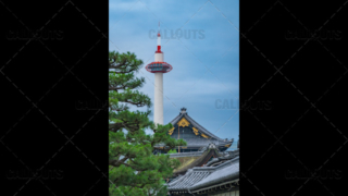 Kyoto tourist attractions. Higashi Hongan-ji Temple roof with Kyoto Tower in the background 02.