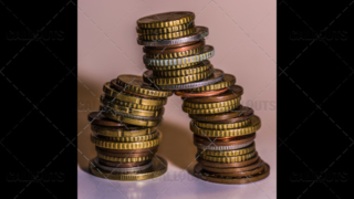 An Unstable Pyramid of Used Coins