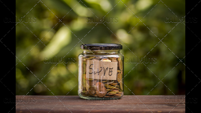 A Jar with Coins with a Save Note Inside, Centered