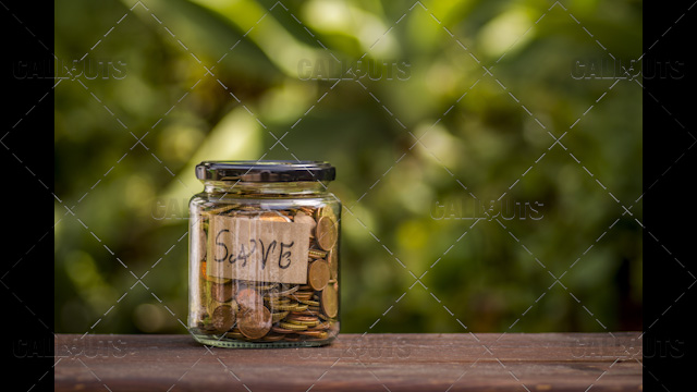 A Jar with Coins with a Save Note Inside, Left