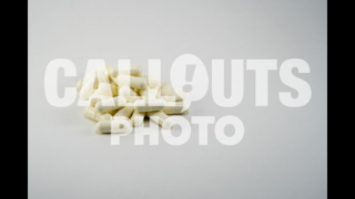 Pile of White Medicine or Supplements, White Background, Text Space