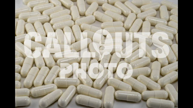 White Medicine or Supplements Covering Entire Image