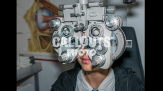 Young Teenage Boy Going Through Eye Exam 02, Ophthalmic Testing Device
