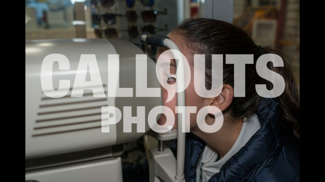 Young Teenage Girl in Eye Exame Checking Eye Vision with Machine 02