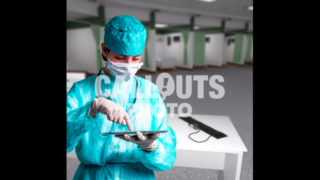 Young Medical Professional with Protective Gear, Holding Tablet, Emergency Ward Background