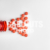 Red Medicine or Supplement Pills Pouring out of Red Bottle, White Background, Text Space