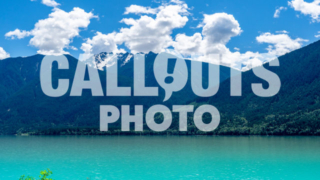 Open glacier lake with mountains, cloudy sky in backgroud