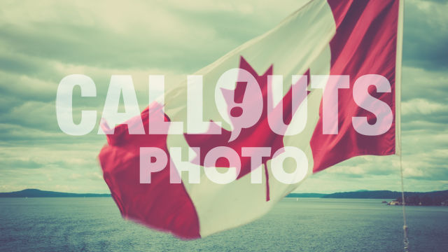 Canadian flag over ocean