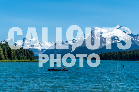 Canoes on Maligne Lake, Mountains and Forest